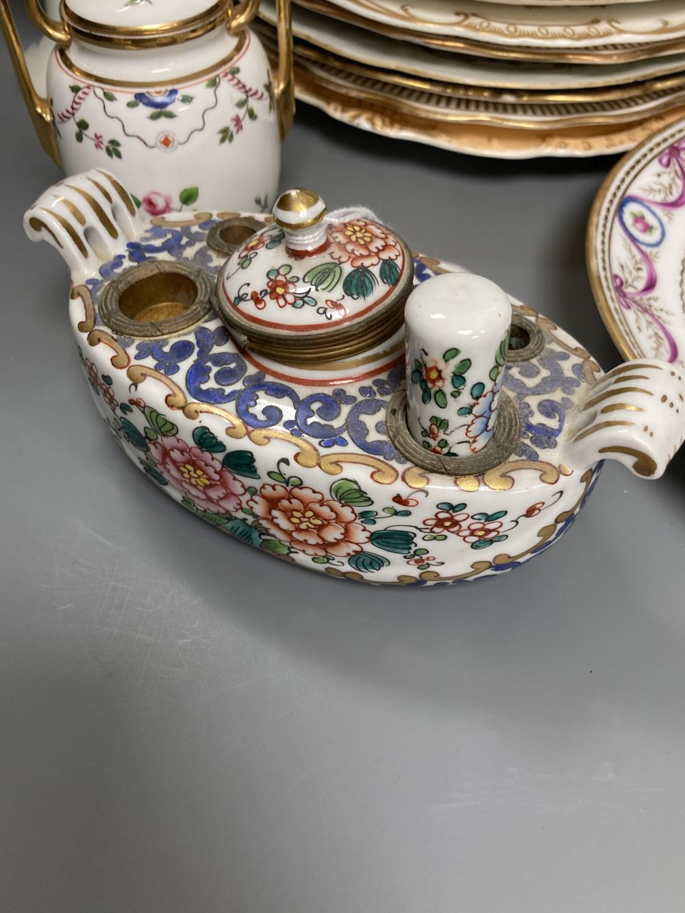 A Worcester Kakiemon vase, c.1765, a 19th century Paris porcelain plate and three tea bowls and 19th century English porcelain plates e